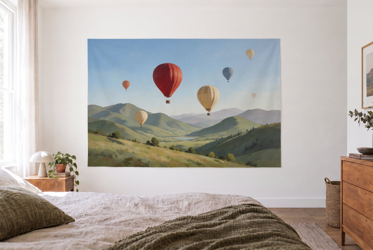 Hot air balloons over mountains oil painting tapestry in the bright bedroom opposite the bed, wooden dresser at right