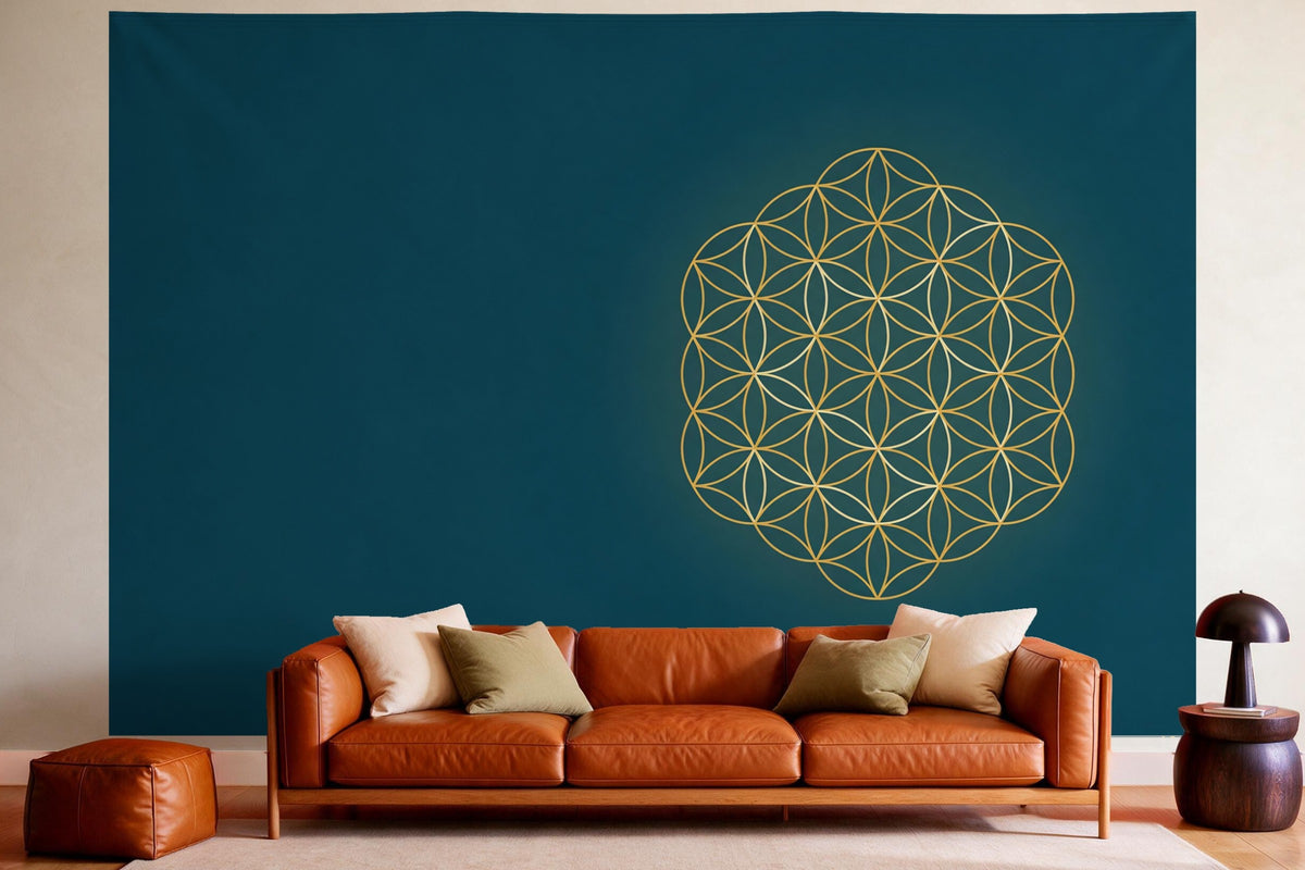 Wall decor in a cosy living room above the leather sofa: printed fabric tapestry Flower of Life in Gold and Blue