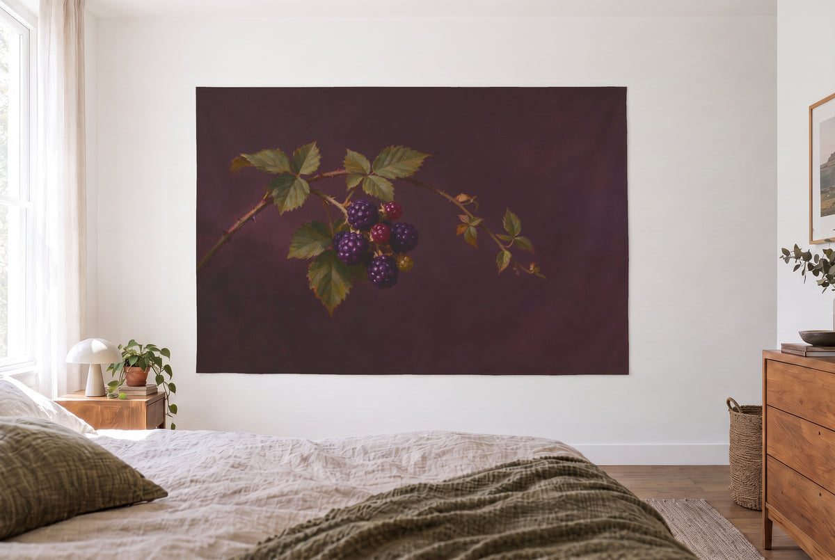 Blackberry Branch with Ripe Berries tapestry in the bright bedroom opposite the bed, wooden dresser at right – violet