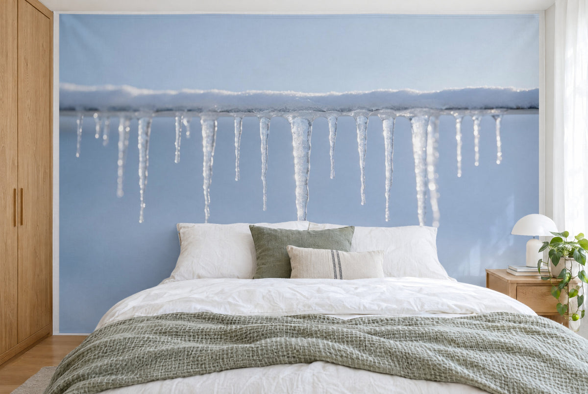 XXL printed fabric: row of icicles centred under a snowy roof edge before ice blue, full wall behind the bed