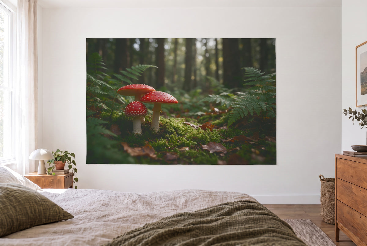Fly agarics in the moss tapestry in the bright bedroom opposite the bed, wooden dresser at right – red and green
