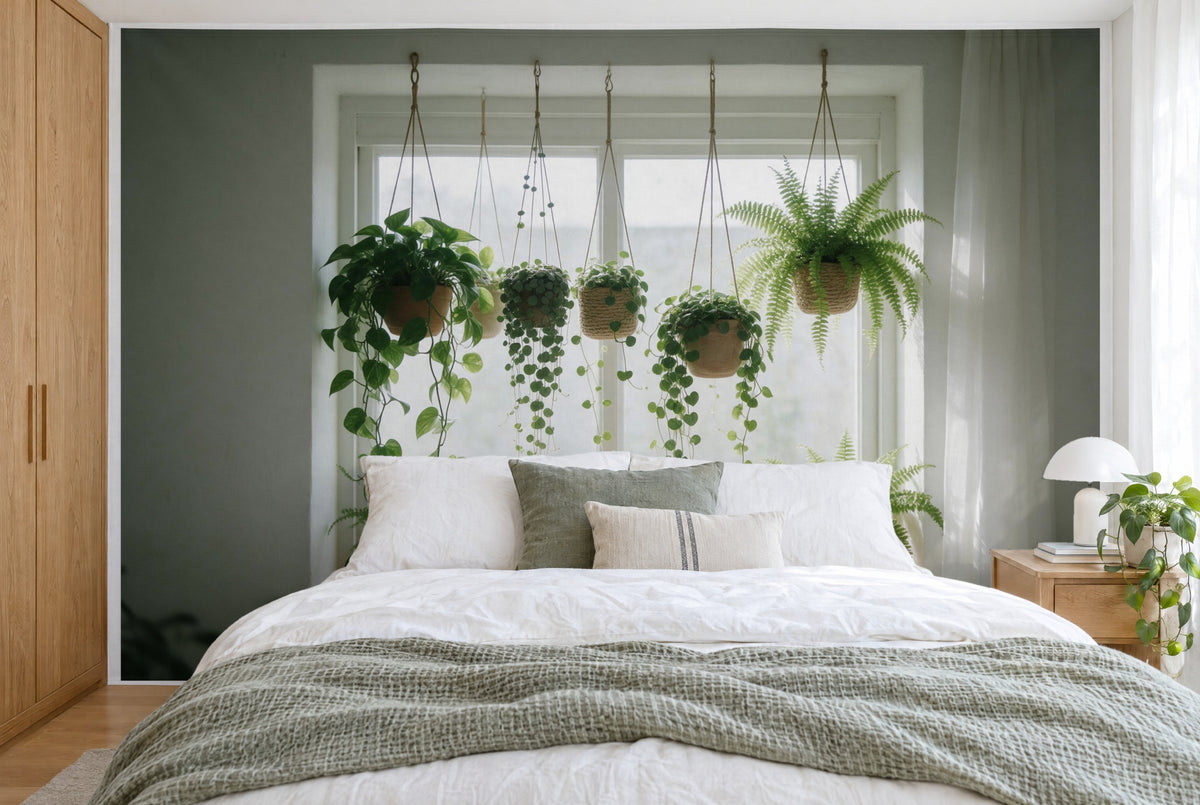 XXL printed fabric: six hanging plants centered before the window, curtain at right, filling the wall behind the bed