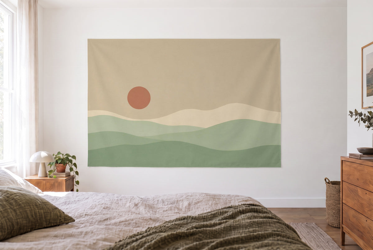 Japandi hills with round sun tapestry in the bright bedroom opposite the bed, wooden dresser at right – beige and green
