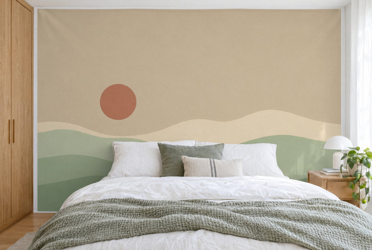 XXL printed fabric: red sun disc at left above gentle green rolling hills, filling the wall behind the bed