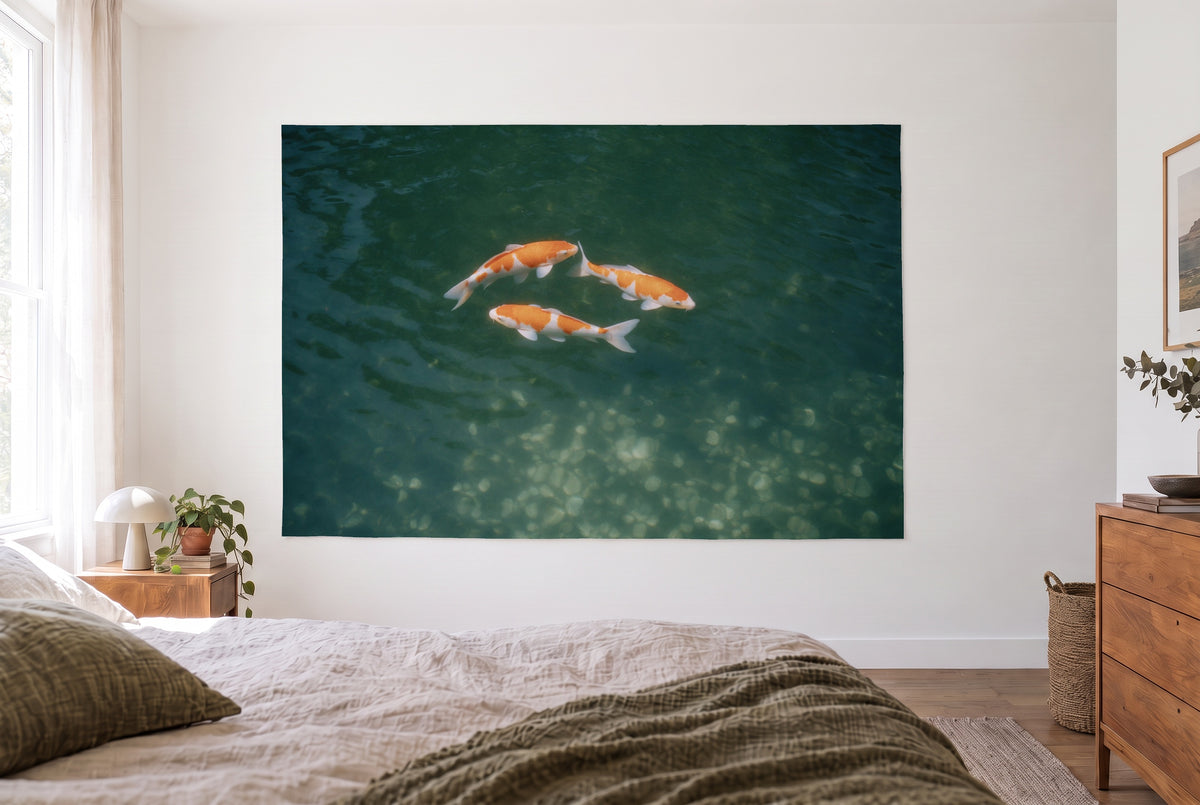 Koi Carp from Above tapestry in a bright bedroom opposite the bed, a wooden dresser on the right – orange and deep green