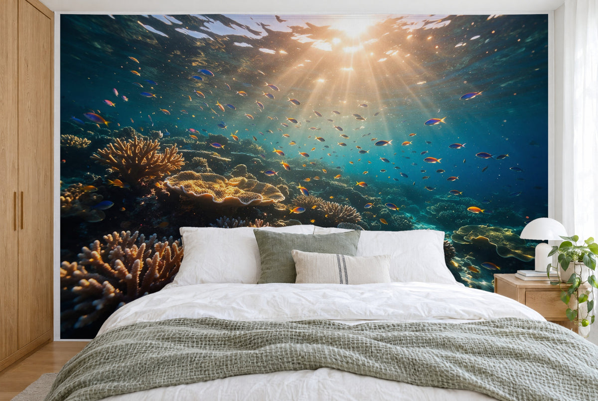 XXL printed fabric: sun rays at the top center above the reef and schools of fish, filling the wall behind the bed
