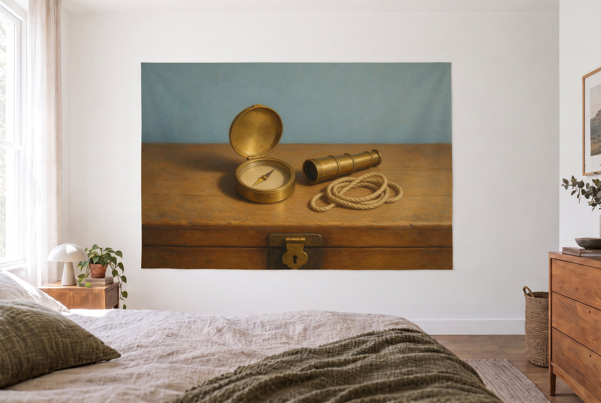 Brass compass with telescope tapestry in a bright bedroom opposite the bed, wooden dresser on the right – gold and blue