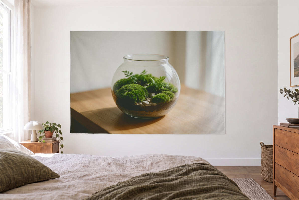 Moss Terrarium tapestry in a bright bedroom opposite the bed, a wooden dresser on the right – green, white and brown
