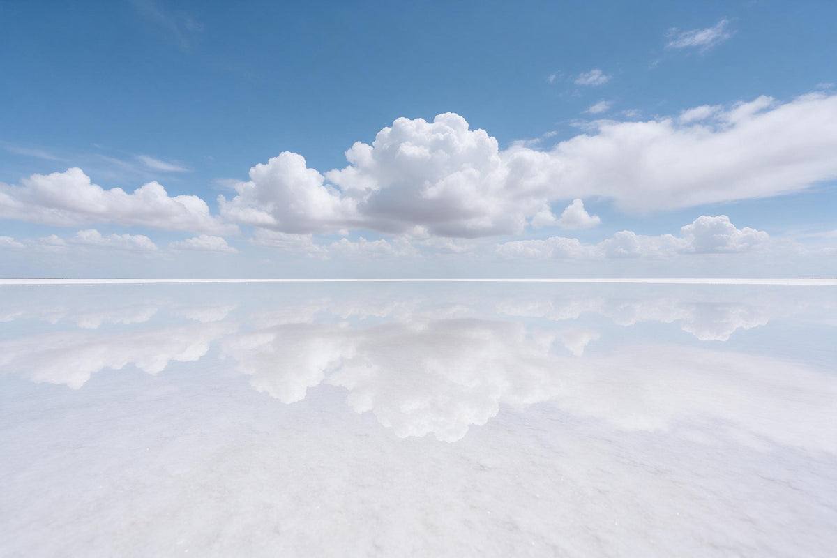 Salt lake mirrors white cumulus clouds in the blue sky, tapestry printed on fabric – blue and white