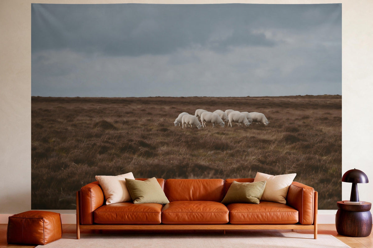 XXL wall tapestry Sheep on the Heath as wall decor in a cosy living room above the leather sofa
