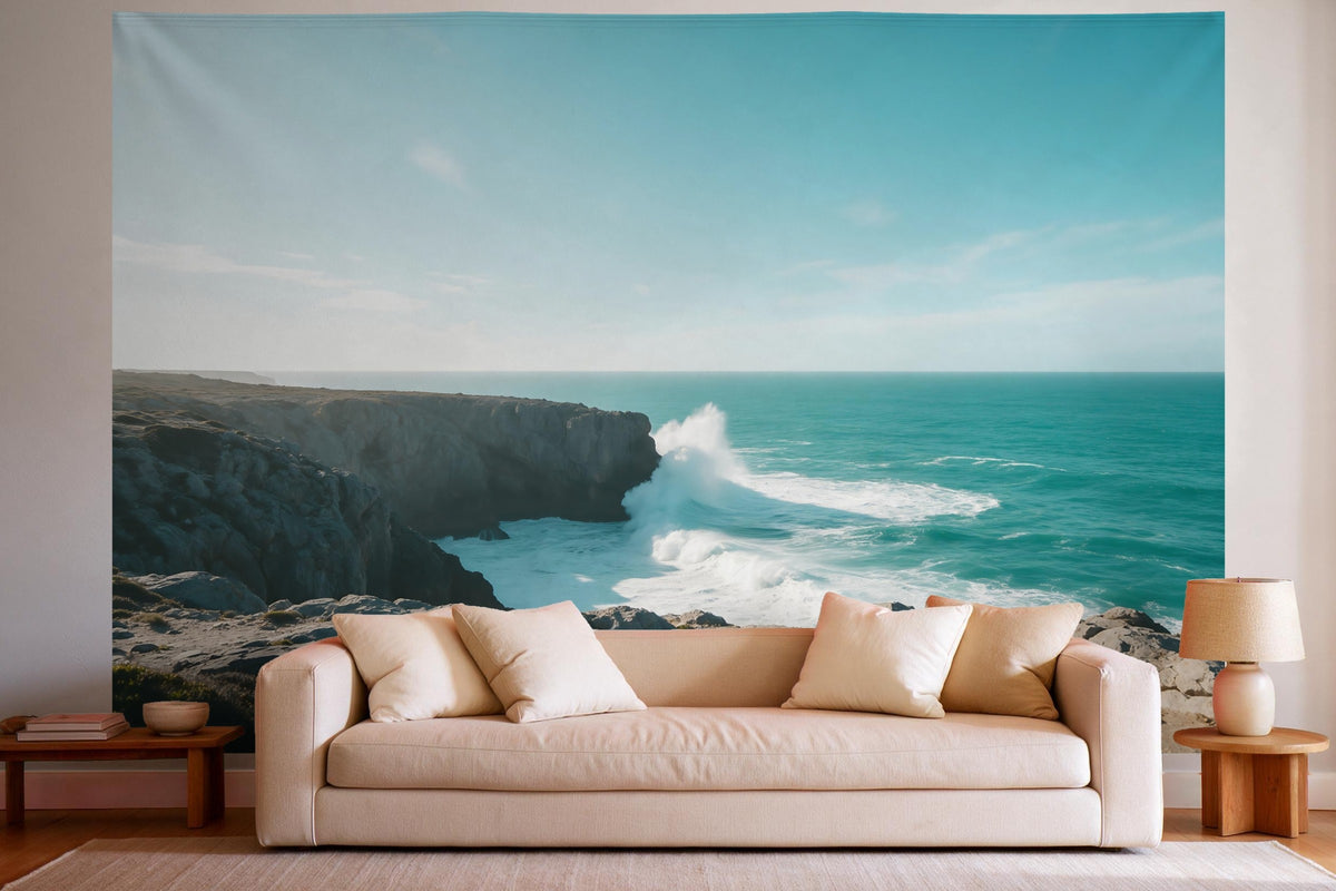 Tapiz de pared XXL Playa en costa rocosa como decoración en un salón luminoso sobre el sofá