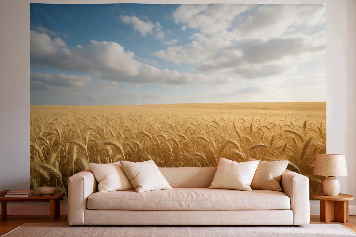 Tapiz de pared XXL Campo de trigo bajo cúmulos como decoración en un salón luminoso sobre el sofá