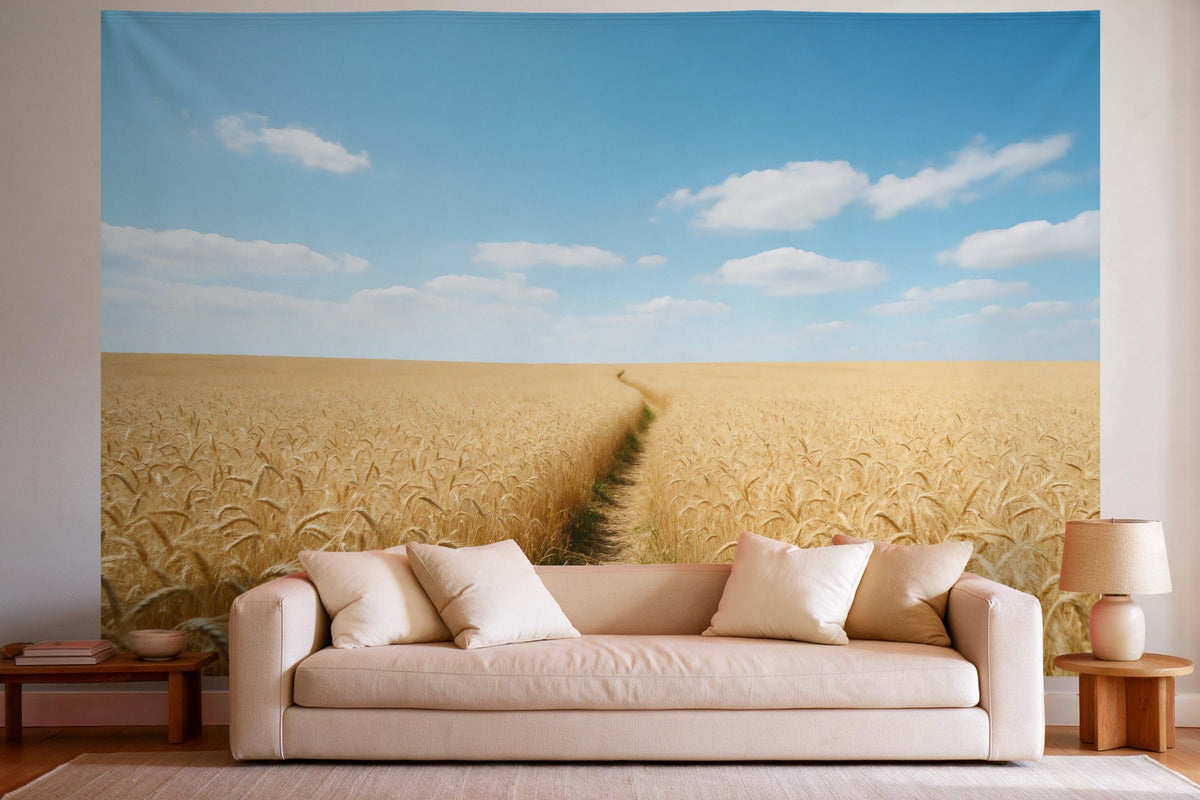 Tapiz de pared XXL Campo de trigo con sendero como decoración en un salón luminoso sobre el sofá
