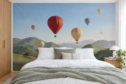 XXL printed fabric: red hot air balloon left of centre, balloons over hills, filling the wall behind the bed