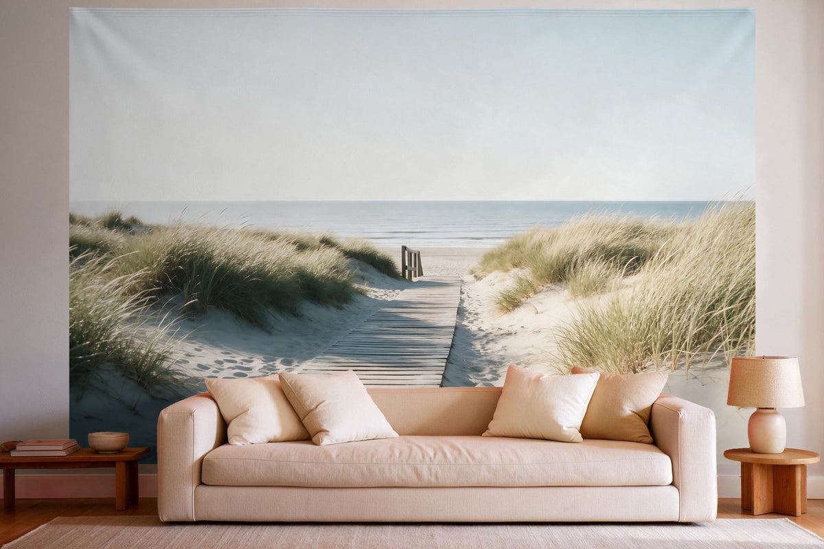 Tapiz de pared XXL con sendero de dunas hacia la playa como decoración en un salón luminoso sobre el sofá