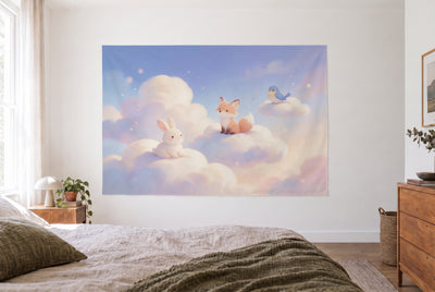Animals on the Clouds tapestry in a bright bedroom opposite the bed, wooden dresser at right – pink and blue