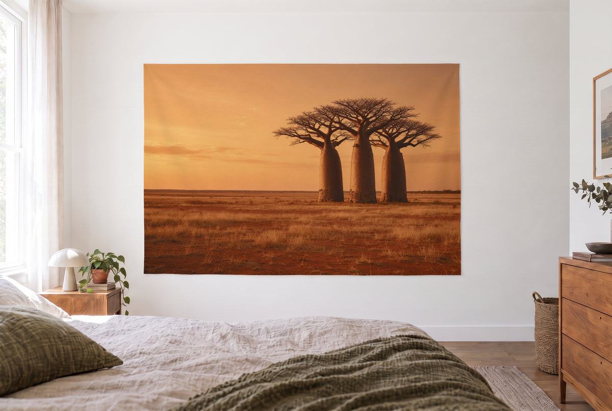 Baobab trees in Africa at sunset tapestry in a bright bedroom opposite the bed, wooden dresser at right – orange