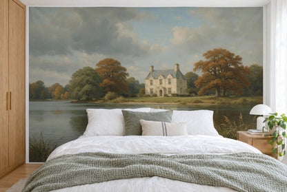 XXL printed fabric: pale stone house right of center by the lake, autumn trees and clouds, full wall behind the bed
