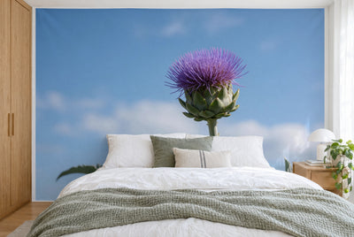 XXL printed fabric: violet artichoke flower in the centre against a blue sky, filling the wall behind the bed