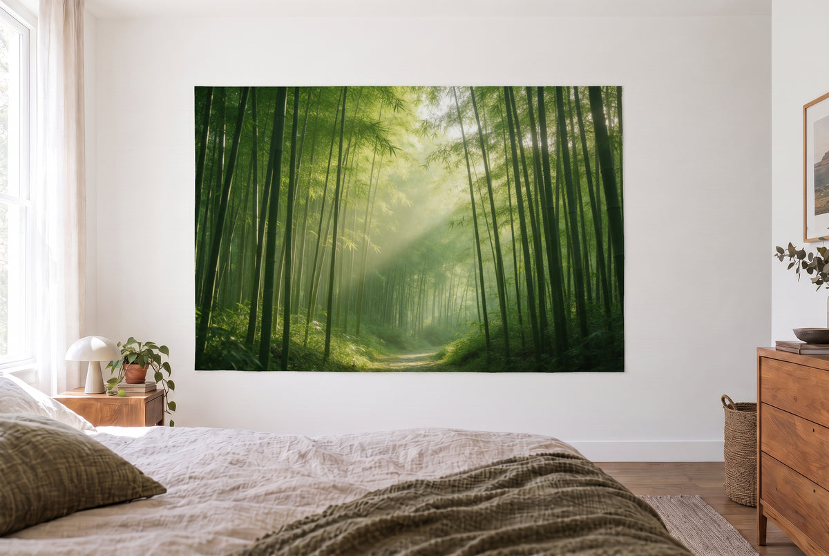 Bamboo Forest in Morning Light tapestry in a bright bedroom opposite the bed, wooden dresser at right – green and gold