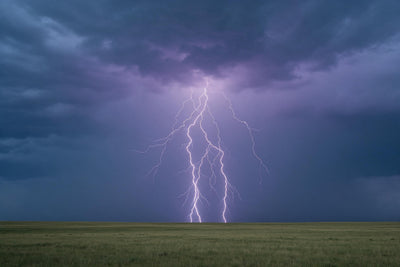 Storm lightning over a wide grassy plain with strikes in the centre, tapestry printed on fabric – violet and olive green