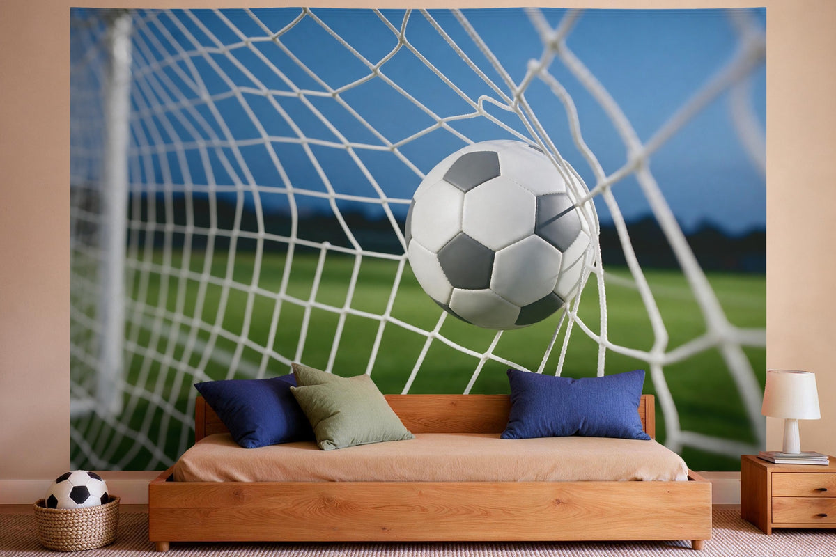 Tenture murale XXL Ballon de foot dans le filet en déco murale dans une chambre de garçon