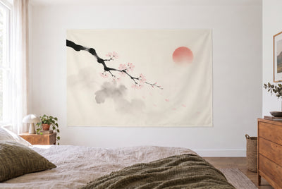 Cherry Blossom Branch in Ink tapestry in a bright bedroom opposite the bed, wooden dresser at right – cream and pink