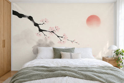 XXL printed fabric: cherry blossom branch at upper left, a pale reddish sun at right, filling the wall behind the bed