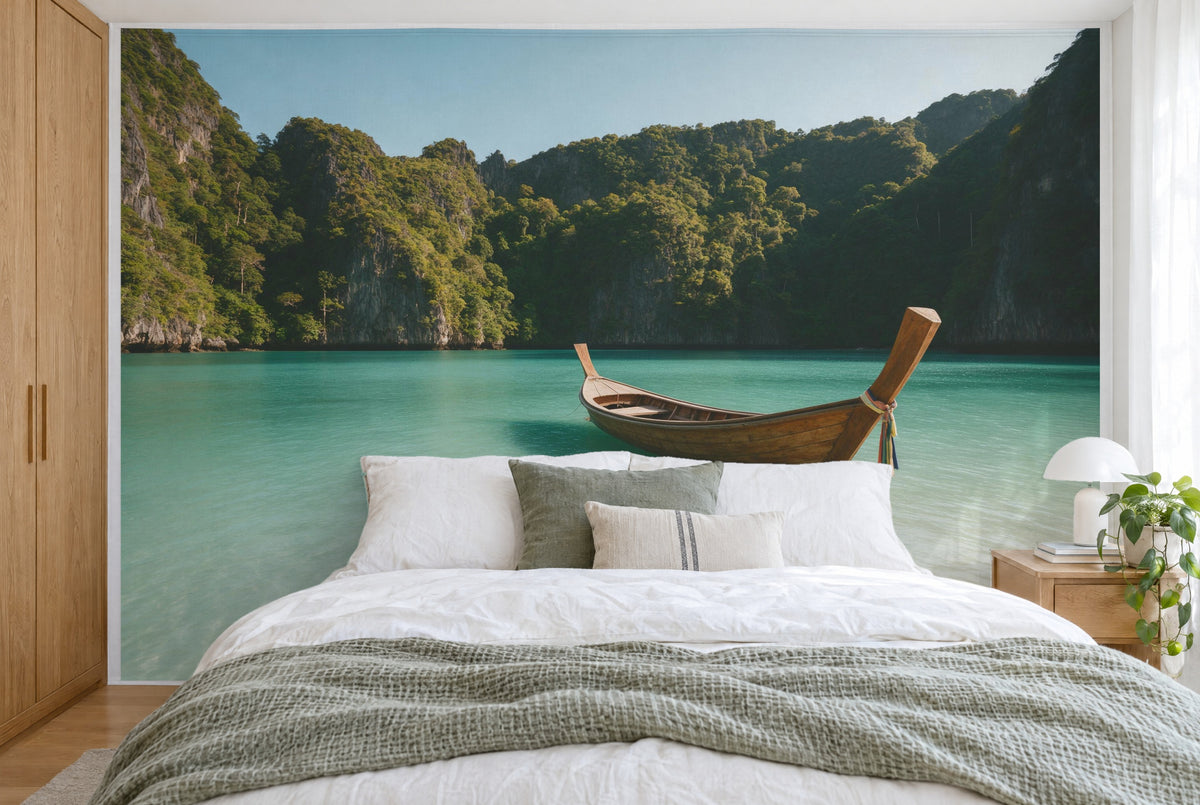 XXL printed fabric: longtail boat at right in a turquoise bay before green limestone cliffs, full wall behind the bed