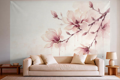 Tapiz de pared XXL Rama de magnolia en acuarela como decoración en un salón luminoso sobre el sofá