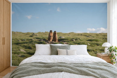 XXL printed fabric: two marmots left of centre, alpine meadow and sky all around, filling the wall behind the bed