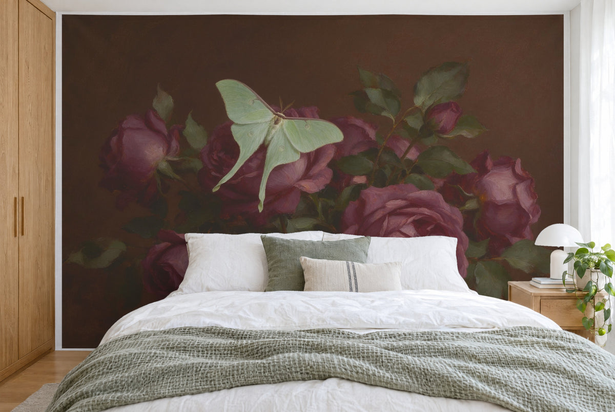 XXL printed fabric: pale green moth on plum-colored roses, filling the wall behind the bed