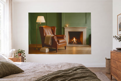 Tapiz sillón orejero y chimenea en un dormitorio claro frente a la cama, cómoda de madera a la derecha – marrón y verde