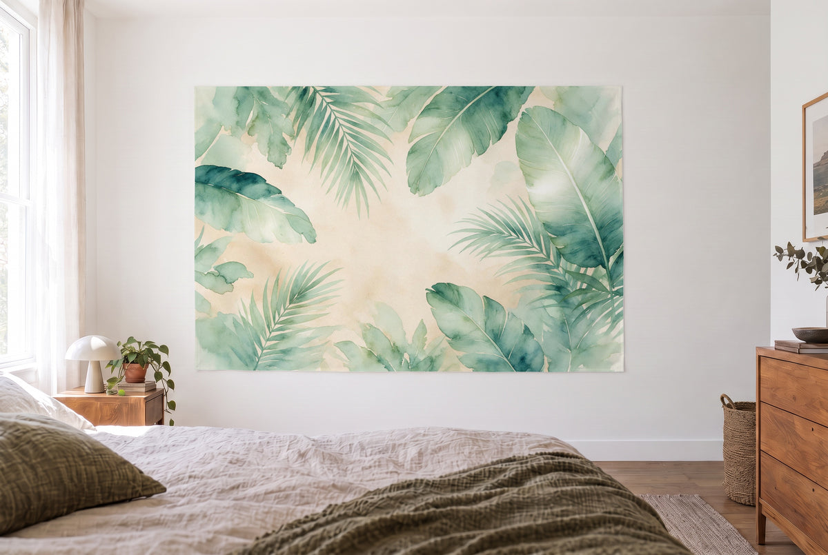 Tropical Palm Leaves in Watercolor tapestry in a bright bedroom opposite the bed, wooden dresser at right – green and sand