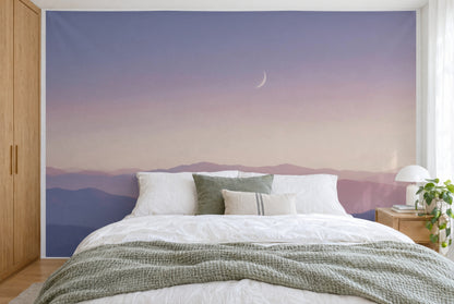 XXL printed fabric: pale crescent moon top right above blue and pink mountain ridges, filling the wall behind the bed