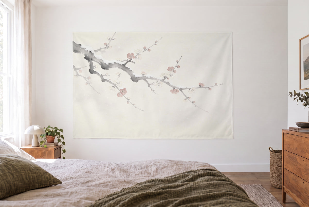 Japanese Plum Blossoms in the Snow tapestry in the bright bedroom opposite the bed, wooden dresser at right – gray pink