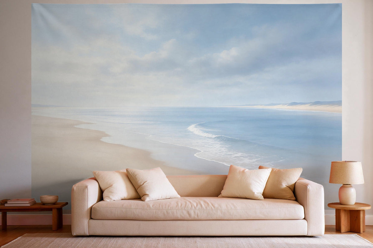 Tenture murale XXL Plage de sable sous ciel nuageux en déco murale dans un salon lumineux au-dessus du canapé