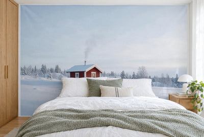 XXL printed fabric: red sauna cabin left of centre, wide winter sky above, filling the wall behind the bed