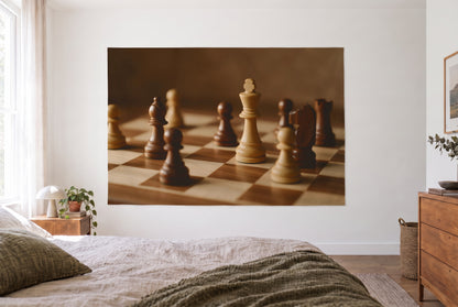 Chess pieces on the board tapestry in a bright bedroom opposite the bed, wooden dresser on the right – brown and beige