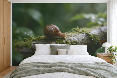 XXL printed fabric: striped snail at left on a mossy branch with drops, filling the wall behind the bed