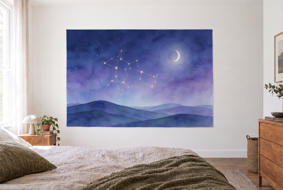 Constellations over gentle hills tapestry in the bright bedroom opposite the bed, wood dresser on the right – blue and gold