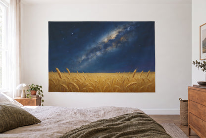 Starry sky over wheat field tapestry in the bright bedroom opposite the bed, wooden dresser at right – blue and yellow