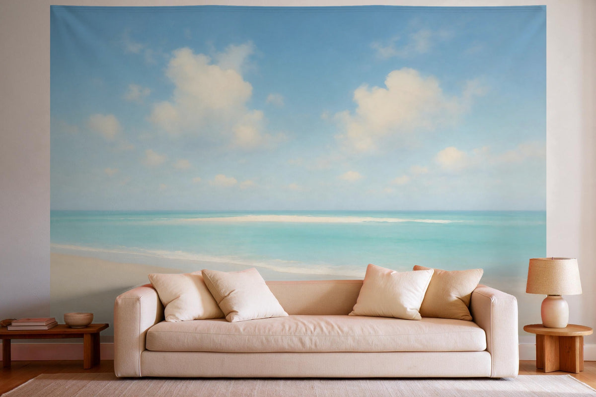 Tapiz de pared XXL Playa bajo cielo azul nublado como decoración en un salón luminoso sobre el sofá