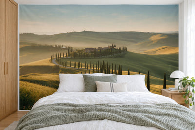 XXL printed fabric: country estate in the centre on a hill, cypresses and fields all around, filling the wall behind the bed